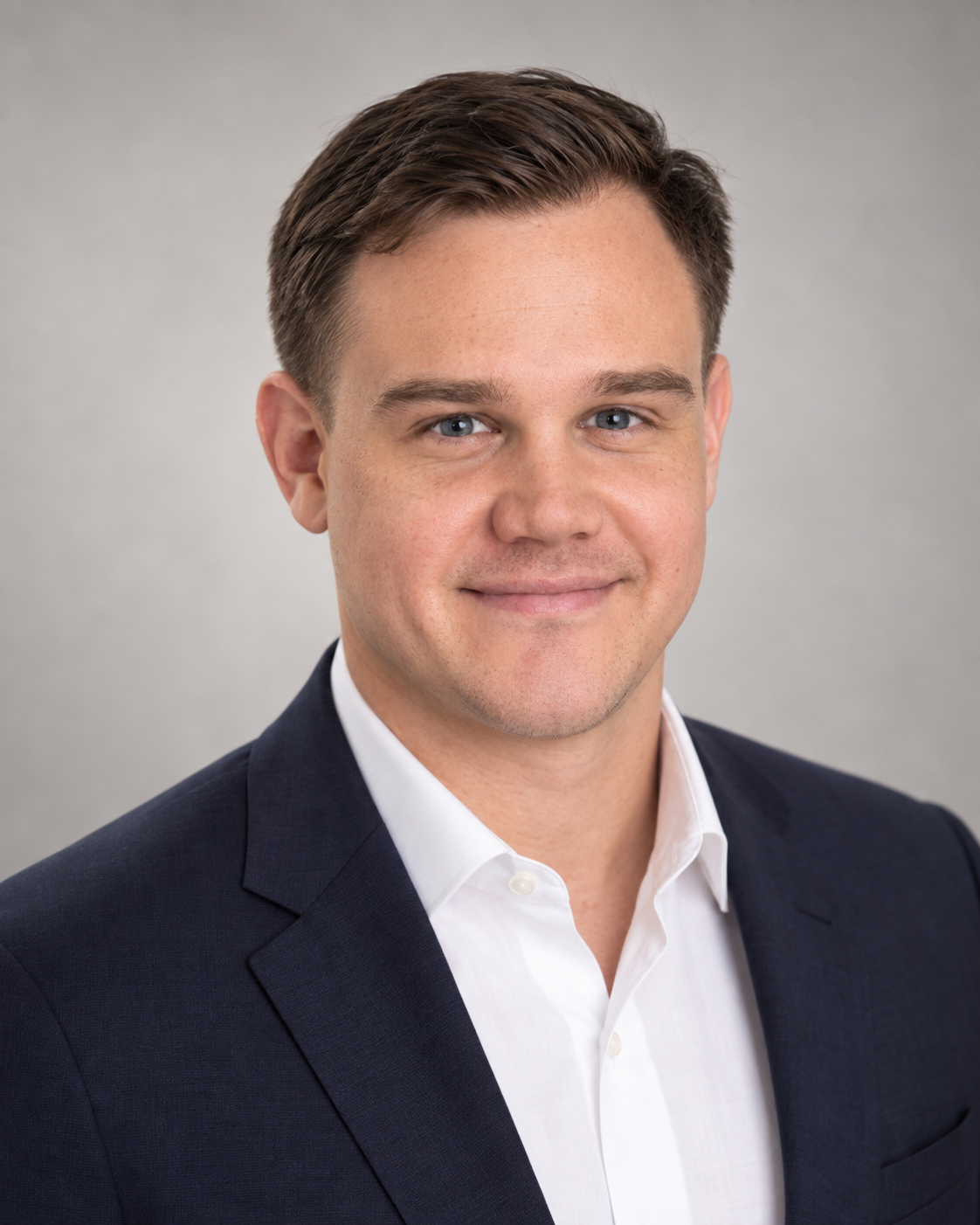 Joseph Bunster wearing a navy blazer and white shirt